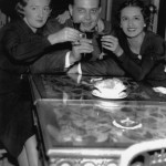 photograph of a man and two women toasting to the end of Prohibition