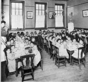 One of the most fundamentally important services offered by settlement houses like the Young Women’s Union was childcare. In this photograph from around 1900, women provide meal service to a room full of young Jewish immigrants around 1900. (Special Collections Research Center, Temple University Libraries) 