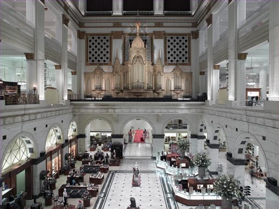 A photograph of the interior court of the former Wanamaker's store on Market Street, featuring the Grand Organ acquired from the St. Louis World's Fair of 1904.
