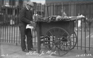 man with pretzel cart preparing for customers