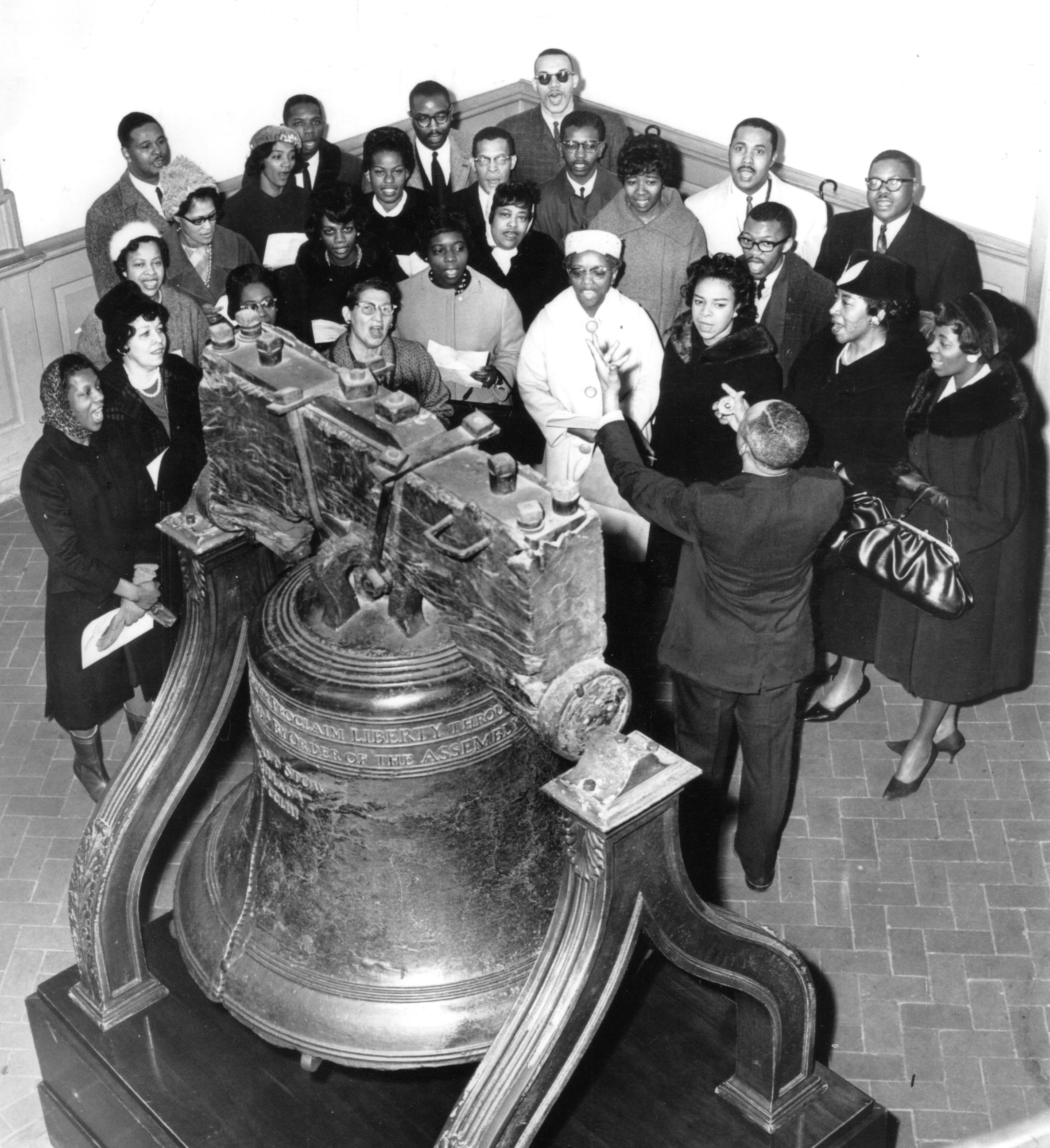 photograph of a group observing the Liberty Bell