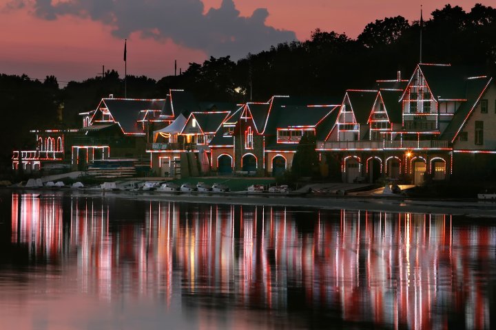 Photograph of Boathouse Row at night, lit up with outdoor lights