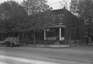 Photograph of intersection with street sign.