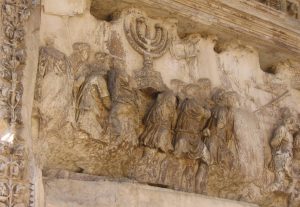 In Rome on the Triumphal Arch of Titus, which was built in 82 C.E. there is a relief depicting Titus’s army with the plunder from the Temple in Jerusalem which they destroyed in 70 C.E. A menorah is prominently displayed among the spoils. (Wikimedia Commons)