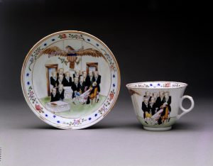 Photograph of a plate and teacup.