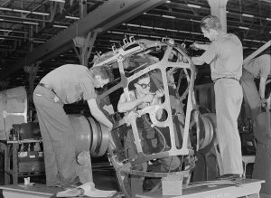 Photograph of workers in a bomb assembly plant.