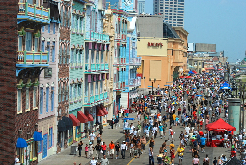 color photograph of Atlantic City Boardwalk with Bally's casino visible in background and air show crowds on the boardwalk.