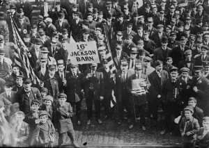 A group of strikers and sympathizers come together in public to demonstrate the solidarity of organized workers.