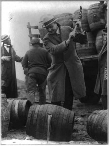 General Smedley Butler destroying a keg of beer with an axe