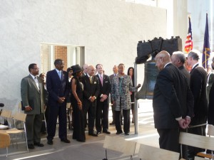 A color photograph of a small crowd gathered at the Liberty Bell