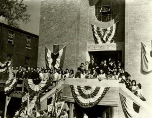 Photograph taken during the dedication of the Holy Redeemer Church, the image shows a strong turnout for the event.