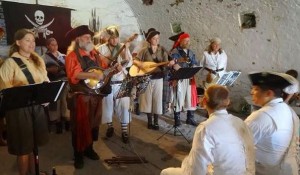 Color photo of the Sea Dogs singing shanties at the annual pirate weekend at Fort Mifflin, Philadelphia.