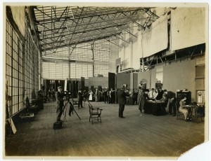 a sepia tone photograph of Lubinville studio showing glass ceiling and several active sets