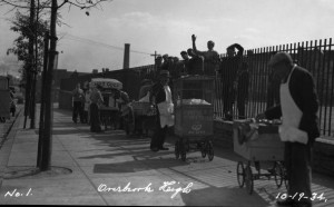 Vendors waiting outside of Overbrook High School in 1934.