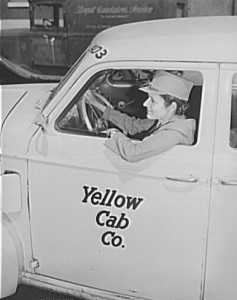 Mrs. Suzanne O'Donnell driving a Yellow Cab Co. Taxi in Philadelphia.