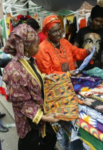 A vendor showing off some traditional African wares during the ODUNDE festival.