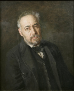 A self-portrait painting of Thomas Eakins leaning backward at an angle. He wears a black vest, suit jacket, and bow tie. He has salt-and-pepper grey hair, beard and mustache. The background is splotchy, somewhat abstract mixture of brown and dark grey tones.