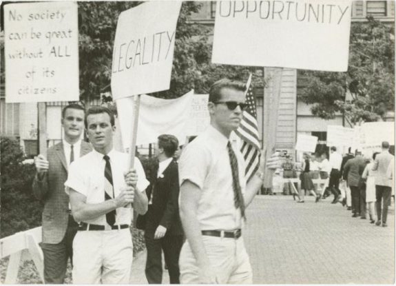 Black and white photograph of three men picketing for gay rights in front of Independence Hall.