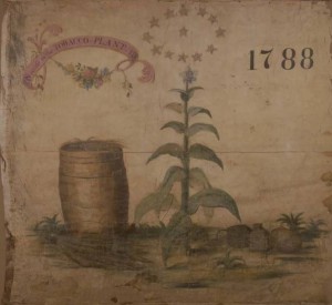 A silk banner representing the tobocconist occupation at the Grand Federal Procession. On the banner are painted the design of a tobacco plant bottle and bladder of snuff, thirteen stars, and a tobacco barrel beneath a pink ribbon which reads, “Success to the Tobacco Plant” and the date, “1788.”