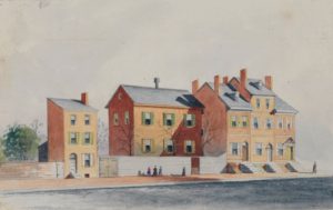 Watercolor painting of three brick buildings.
