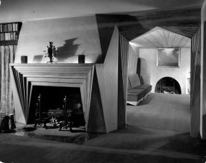 A black and white photograph of the fireplace and doorway from the Bok House library.