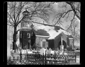 A black and white photograph of the Holy Trinity church and grave yard in Wilmington, Delaware