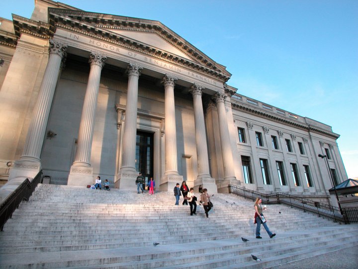 A color photograph of the main entrance to the Franklin Institute showing Greek columns and stairs
