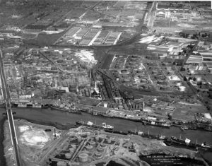 Black and white aerial photograph of oil refinery.