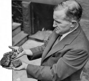 An inspector examines a bootlegged coal shipment 