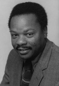 a black and white headshot of Dr. Molefi Kete Asante