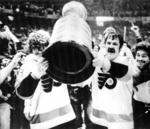 Flyers Bobby Clarke and Bernie Parent celebrate with the Stanley Cup in 1974
