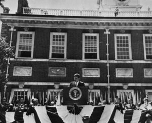 President John F. Kennedy in front of Independence Hall delivering a July 4th address.