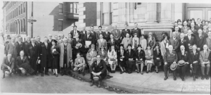 A black and white photograph of the members of the 1929 American Ornithologists' Union meeting held in the Academy of Natural Sciences. Participants are posed seated or standing in rows.