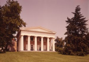 A color photograph showing a Greek Revival style entrance to a mansion with six front columns