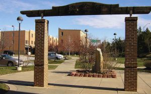 color photo of entrance arch at Hing Wah Yuen mixed-income townhouse development, Chinatown North, Philadelphia. 2005 photo.