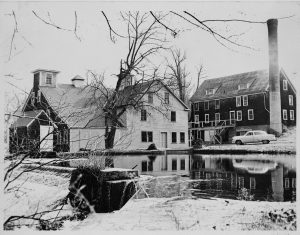 A black and white photograph of the Garret Snuff Mill, situated on the Brandywine Creek.