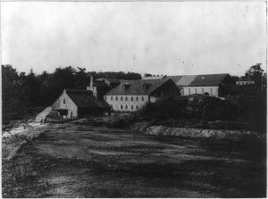 A black and white photograph of the old furnace in Cornwall, Pennsylvania.