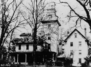 A black and white photograph of the manor house at the Batsto iron plantation, in its late ninenteenth century Italianate form.