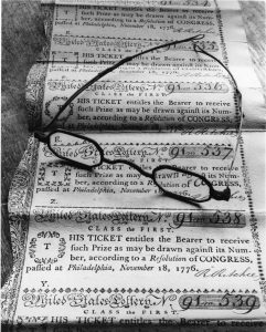 A black and white photograph of United States Lottery tickets.