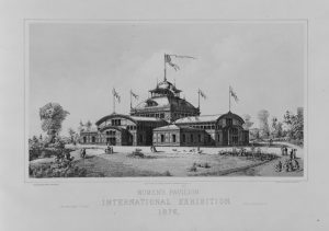 A black and white illustration of the Women's Pavilion. The large building has rounded roof lines and a prominent cupola. The roof is adorned with five flags.