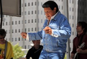 a color photograph of Chubby Checker dancing the twist in 2010