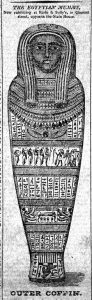 A black and white illustration of a heavily decorated mummy coffin in the shape of a human