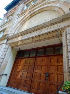 a color photogrpah of the entrance to Musical Fund Hall. The words "Musical Fund Hall" are carved above the door.