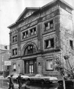 a black and white photograph of Musical Fund Hall in a state of disrepair