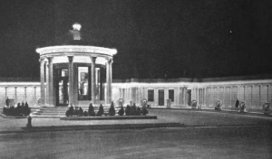 a black and white photograph of a gas station modeled after a Greek temple.