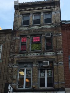 A color photograph of 704 Sansom Street in Philadelphia. 