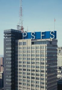 A color photograph of the PSFS building. The building is rectangular in shape, with a blue sign on the top with the letters P, S, F, and S in capital letters.