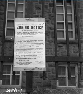 A black and white photograph of a zoning notice in Philadelphia.