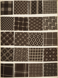 This photograph shows a page from a book of fabric samples. Each of the twenty samples has a different pattern, but they all have a brown and white color scheme.