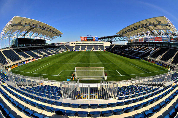 This color photograph shows the Talen Energy Stadium in Chester, Pennsylvania. The seats are blue. Several of them spell out